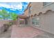 View of covered patio, tile flooring, landscaped backyard and privacy wall at 776 Anacapri St, Las Vegas, NV 89138