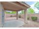 View of covered patio and landscaped backyard and privacy wall at 776 Anacapri St, Las Vegas, NV 89138