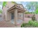 Covered patio with tile flooring and landscaped yard in rear at 776 Anacapri St, Las Vegas, NV 89138