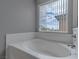 Close-up of a bathtub with a window overlooking a neighborhood at 776 Anacapri St, Las Vegas, NV 89138