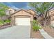 Charming single-Gathering home with a two-car garage and desert landscaping at 776 Anacapri St, Las Vegas, NV 89138