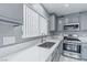 Well-lit kitchen with stainless steel appliances and new quartz countertops at 776 Anacapri St, Las Vegas, NV 89138