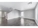 Bright and open living area featuring wood-look floors and neutral paint at 776 Anacapri St, Las Vegas, NV 89138