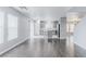 Spacious living room and kitchen area with modern appliances and hardwood flooring provides open living space at 776 Anacapri St, Las Vegas, NV 89138
