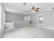 Bright and airy loft space features neutral walls, plush carpeting, and a modern ceiling fan at 776 Anacapri St, Las Vegas, NV 89138