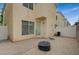 Backyard featuring gravel ground cover, brick perimeter, and access to the house at 8261 Golden Flowers St, Las Vegas, NV 89139
