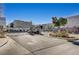 Gated community entrance with decorative stone pillars and lush landscaping at 8261 Golden Flowers St, Las Vegas, NV 89139