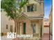 Charming two-story home features a stone facade, tiled roof, and well-maintained landscaping at 8261 Golden Flowers St, Las Vegas, NV 89139