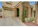 Inviting front exterior with stone facade, desert landscaping, and attached one-car garage at 8261 Golden Flowers St, Las Vegas, NV 89139
