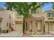 Inviting home featuring a stone facade, desert landscaping, an attached one-car garage, and shade tree at 8261 Golden Flowers St, Las Vegas, NV 89139