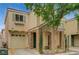 Charming home featuring a stone-accented entrance, desert landscaping, and a attached one-car garage at 8261 Golden Flowers St, Las Vegas, NV 89139