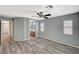 Main bedroom boasts updated flooring, a ceiling fan, and an ensuite bathroom at 8261 Golden Flowers St, Las Vegas, NV 89139