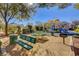 Shaded community playground with picnic benches and BBQ grills for outdoor enjoyment at 8261 Golden Flowers St, Las Vegas, NV 89139