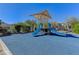 Community playground features a shaded area with dual slides for active fun at 8261 Golden Flowers St, Las Vegas, NV 89139