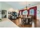 Inviting dining room features hardwood floors, elegant lighting, and ample natural light at 8325 Villa De Medici St, Las Vegas, NV 89131