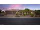 Charming single-story home boasts a well-manicured yard, stone accents, and a three-car garage at 8325 Villa De Medici St, Las Vegas, NV 89131