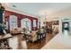 Open-concept living room showcasing hardwood flooring, ornate details, and large windows at 8325 Villa De Medici St, Las Vegas, NV 89131