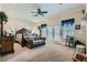 Bright main bedroom with a king bed, sitting area, and access to the outdoors at 8325 Villa De Medici St, Las Vegas, NV 89131