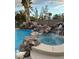 Backyard oasis featuring a sparkling pool with rock waterfall and spa, perfect for relaxation at 8325 Villa De Medici St, Las Vegas, NV 89131