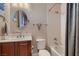 Bathroom features round mirror, textured wall, and combined shower and tub at 8705 Killians Greens Dr, Las Vegas, NV 89131