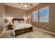 A cozy bedroom with a ceiling fan, shutters, and comfortable furniture at 8705 Killians Greens Dr, Las Vegas, NV 89131