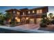 Stunning two-story home with a three-car garage and well-maintained landscaping at 8705 Killians Greens Dr, Las Vegas, NV 89131