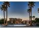 Impressive home featuring lush landscaping, a three-car garage, and a porte cochere at 8705 Killians Greens Dr, Las Vegas, NV 89131