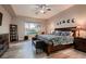 Serene primary bedroom showcasing a spacious layout, large window with a view, and stylish furnishings at 8705 Killians Greens Dr, Las Vegas, NV 89131