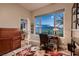 Inviting home office with a scenic view, a functional desk setup, and ample storage space at 8705 Killians Greens Dr, Las Vegas, NV 89131