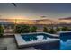 Inviting jacuzzi offers tranquil views of the sunset and desert landscape at 8705 Killians Greens Dr, Las Vegas, NV 89131
