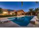 Enjoy the spacious pool with diving board and adjacent jacuzzi at this bright home at 8705 Killians Greens Dr, Las Vegas, NV 89131