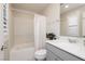 Well-lit bathroom featuring a gray vanity, white countertop, and a tub-shower combination at 881 Cherry Glen Pl, Las Vegas, NV 89138