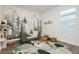 Charming bedroom with a playful mural, cozy decor, and a unique river-themed rug at 881 Cherry Glen Pl, Las Vegas, NV 89138