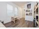 Bright bedroom with bunkbed, wood floors, and bright white walls at 881 Cherry Glen Pl, Las Vegas, NV 89138