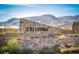 Stone Caledonia sign with desert landscaping and mountain backdrop on a clear, sunny day at 881 Cherry Glen Pl, Las Vegas, NV 89138