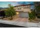 Charming two-story home with manicured front yard, paver driveway, and a spacious two car garage at 881 Cherry Glen Pl, Las Vegas, NV 89138