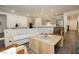 Inviting open-concept living space with gray cabinets and stainless steel appliances at 881 Cherry Glen Pl, Las Vegas, NV 89138