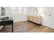 Office space featuring wood floors, white shutters and a woven credenza at 881 Cherry Glen Pl, Las Vegas, NV 89138