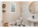 Stylish powder room with geometric tile floors, decorative shelves, and modern fixtures at 881 Cherry Glen Pl, Las Vegas, NV 89138