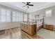 Comfortable bedroom featuring wood floors and plenty of natural light at 9243 White Waterfall Ave, Las Vegas, NV 89149