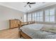 Bedroom with wood floors, natural light, and modern design at 9243 White Waterfall Ave, Las Vegas, NV 89149