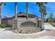Vista Verde community entrance sign with beautiful stone accents and desert landscaping at 9243 White Waterfall Ave, Las Vegas, NV 89149