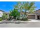 Charming single-story home with a well-manicured yard and a two-car garage at 9243 White Waterfall Ave, Las Vegas, NV 89149