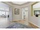 Spacious foyer with tile flooring and a view into the living areas at 9243 White Waterfall Ave, Las Vegas, NV 89149