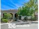 Charming single-story home featuring desert landscaping, a tile roof, and an attached two-car garage at 9243 White Waterfall Ave, Las Vegas, NV 89149