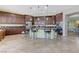 Gourmet kitchen with a large center island, custom cabinetry, and stainless steel appliances at 9243 White Waterfall Ave, Las Vegas, NV 89149