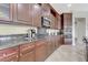 Kitchen featuring granite countertops, gas range, and stainless steel appliances at 9243 White Waterfall Ave, Las Vegas, NV 89149