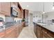 Gourmet kitchen with granite counters, stainless appliances, and center island at 9243 White Waterfall Ave, Las Vegas, NV 89149