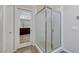 Bathroom featuring a glass shower door and view to the vanity area at 9243 White Waterfall Ave, Las Vegas, NV 89149