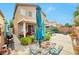 Large backyard featuring an entertaining patio, mature landscaping, and lawn space at 9412 Jewel Lake Ave, Las Vegas, NV 89166